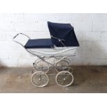 Silver Cross coach built pram with sprung suspension and navy hood/ cover, height to handle 96cm