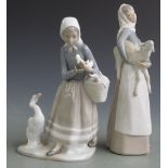 Two Lladro and two Nao figurines, tallest 27cm