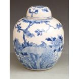 A late 19th/ early 20thC Chinese blue and white lidded pot with Kangxi mark to base, 30cm tall