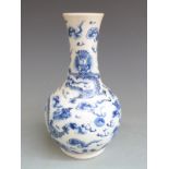 A 19thC Chinese blue and white vase with dragon decoration, 21cm tall