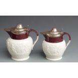 Two circa first quarter 19thC graduated Davenport relief moulded jugs with hallmarked silver