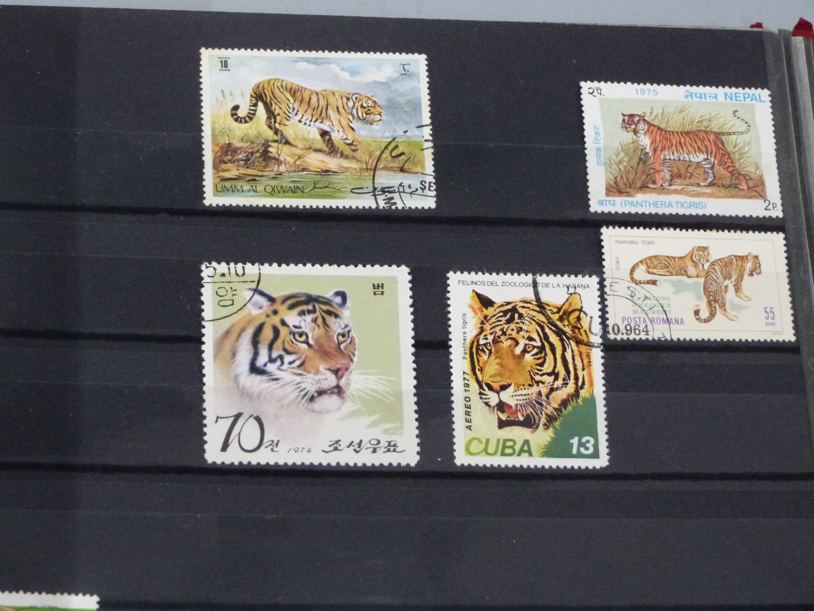 A stockbook of world stamps including mint USA sets 1935-1968