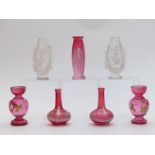 Five pieces of Mary Gregory glass together with a pair of Moser style enamel and gilt cranberry