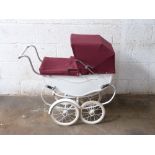 Silver Cross coach built dolls pram with maroon hood, cover and white mudguards to rear wheels,
