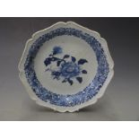 19thC Chinese shallow dish/charger with gadrooned rim decorated with a peony and floral border, H4.