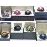 Eight Caithness limited edition glass paperweights including a Dawn and Dusk set, Blue Spiral, Magic