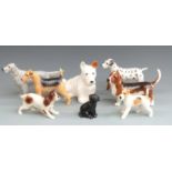 Eight Beswick dog figures including seated Sealyham, tallest 17cm