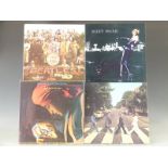 Approximately 25 albums including The Beatles and E.L.O.