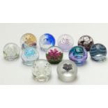 Eleven Caithness limited edition glass paperweights, all with certificate of authenticity