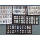 Six albums of cigarette cards including Godfrey Phillips annuals, The Mechanised Age, Famous Minors,