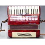 Parrot 48 bass piano accordion with five treble couplers, in red pearloid finish