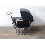 A vintage anonymous coach built dolls pram with sprung suspension, mudguards to front wheels,