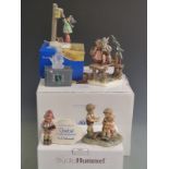 Five Goebel figures including advertising and larger figural groups, some boxed