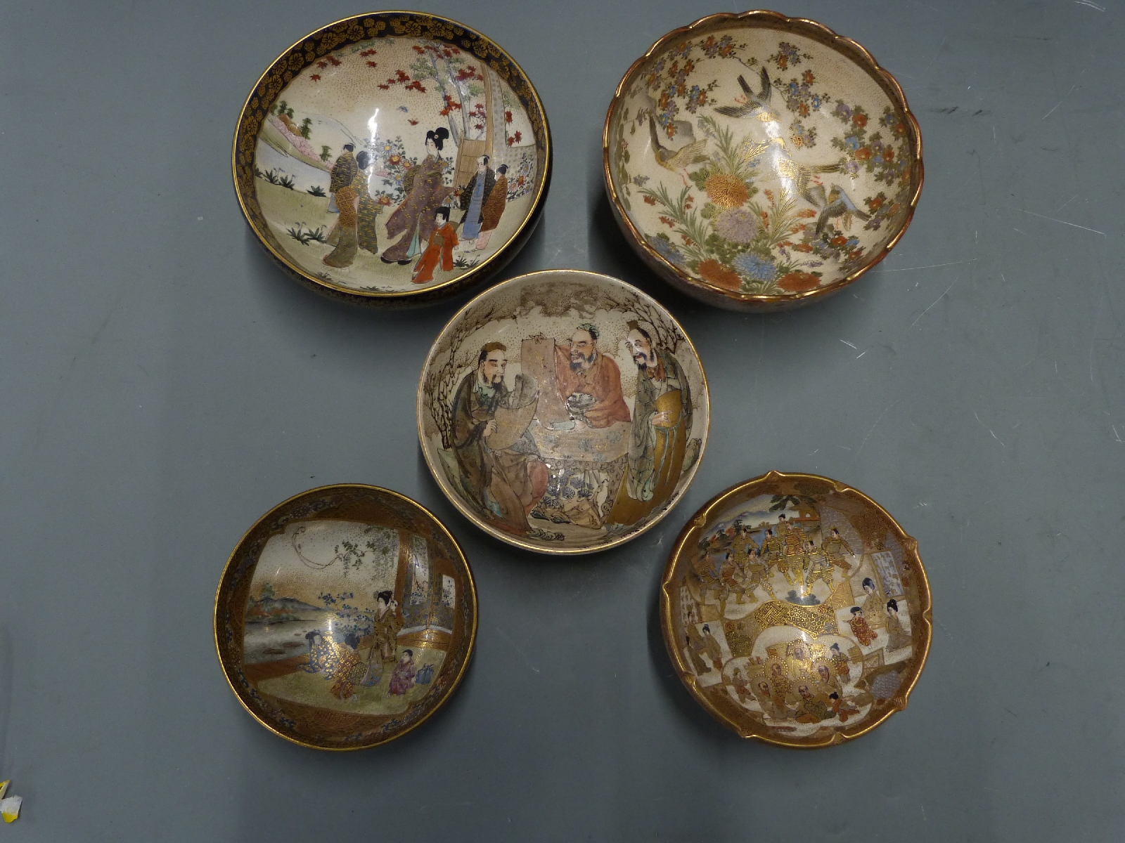 Five Japanese Satsuma bowls, largest diameter 15.5cm