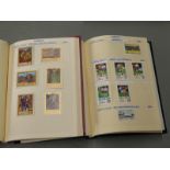 Nine albums of stamps comprising Romania x 5, Paraguay x 2, St Lucia and St Vincent