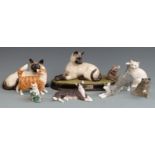 A collection of Beswick cat figures including "Watch It", tallest 15cm
