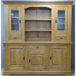 Contemporary light oak dresser with an arrangement of cupboards and drawers, W200 x D54 x H220cm