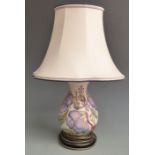 Moorcroft table lamp decorated with mauve flowers and foliage, with shade, H48cm