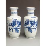 A pair of Chinese blue and white rouleau vases with Qianlong mark to base, 40cm tall