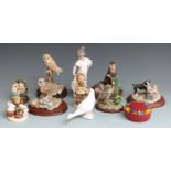 A collection of Border Fine Arts, Nao and Hummel figures, tallest 22cm