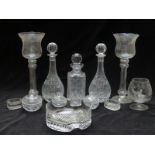 Thirteen pieces of clear glassware including salts, fruitbowl, decanters, large candle holders
