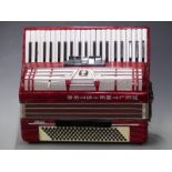 Weltmeister Amigo 120 bass piano accordion with 5 treble and 3 bass couplers in red pearloid finish,