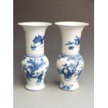 A pair of Chinese blue and white vases with Kangxi mark to base, 41cm tall