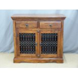 An Eastern hardwood small sideboard with decorative ironwork doors, W100x D46 x H90cm
