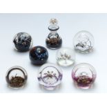 Seven Selkirk glass paperweights and an ink bottle, most limited editions with certificates