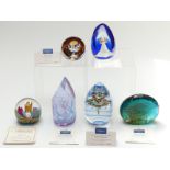 Six Caithness limited edition glass paperweights including Dolphin Duet, Symphony, Hibernation