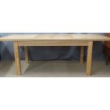 A contemporary oak or similar dining table with extending top with two leaves, max L231 min 160 x