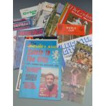 A large collection of football and cricket related booklets, programmes and magazines including