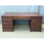 Chinese carved elm twin pedestal desk with an arrangement of nine drawers and dummy arrangement to