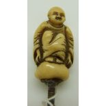 19th/20thC carved ivory seated Buddha with screw fitting by Ranele, possibly a parasol handle, H5cm