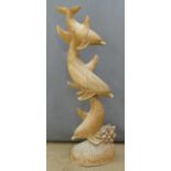 Wooden carving of three leaping dolphins, height 98cm