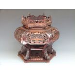 Chinese carved hardwood hexagonal stand with pierced decoration, undershelf and galleried top, H41