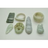 A small collection of jade items comprising two rings and four pendants