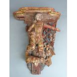A 19thC giltwood and jewelled figural wall bracket, possibly a temple piece, H33cm