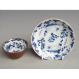 An 18thC Chinese blue and white tea bowl and saucer