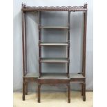 A four tier breakfront whatnot with galleried top, possibly Eastern / Chinese, W101 x D34 x H135cm