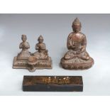 A bronze sculpture of Buddha, two praying figures, a reclining Buddhist figure etc, tallest 18cm