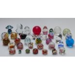 Thirty-five glass paperweights including Caithness, Alum Bay, etc.