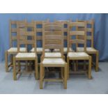 Eight contemporary light oak dining chairs with rush seats