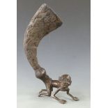 Ashanti 19thC bronze figural horn libation cup, the carved horn attached to an African figure,