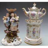 A continental porcelain chocolate pot on pastille burner stand and a porcelain figural group