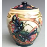 Moorcroft covered vase decorated with flowers, fruit and insects, dated 2002, H15cm