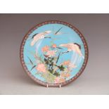 A 19thC Japanese cloisonné charger with crane and floral decoration, diameter 30.5cm