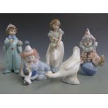 Five Lladro/Nao figures including three Lladro child clowns, tallest 22cm