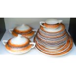 Clarice Cliff dinner ware decorated in the orange Aura pattern with Bizarre and Wilkinson pottery