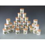 Thirty Portmeirion spice/herb/storage jars with wooden covers decorated in Botanic Garden pattern,